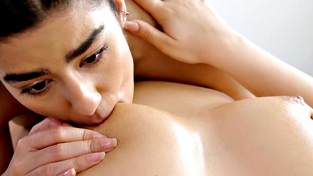 Oiled busty babe pussylicked on massage table by GF