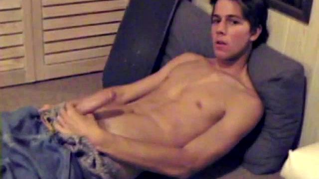 Fabulously tight and lean, Jayden works his cock for a while inside his boxers, and it soon pops out. With the usual noisy straight porn in the background, Jayden gives himself a vigorous hand job.