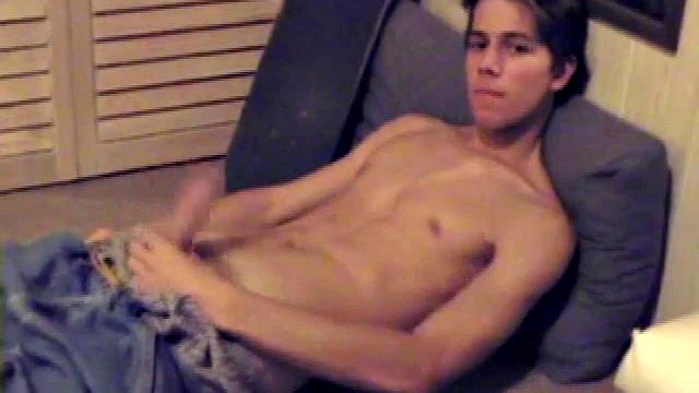 Fabulously tight and lean, Jayden works his cock for a while inside his boxers, and it soon pops out. With the usual noisy straight porn in the background, Jayden gives himself a vigorous hand job.