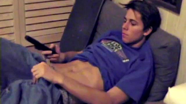 Fabulously tight and lean, Jayden works his cock for a while inside his boxers, and it soon pops out. With the usual noisy straight porn in the background, Jayden gives himself a vigorous hand job.