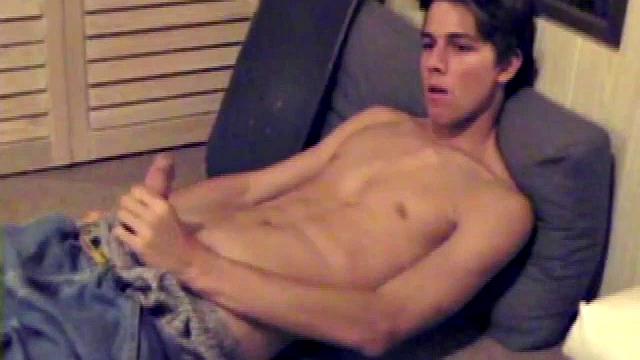 Fabulously tight and lean, Jayden works his cock for a while inside his boxers, and it soon pops out. With the usual noisy straight porn in the background, Jayden gives himself a vigorous hand job.