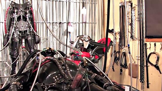 Femdom latex domina torments sub with cock pump