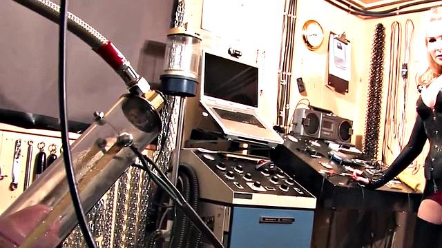 Femdom latex domina torments sub with cock pump