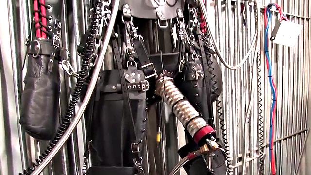 Femdom latex domina torments sub with cock pump