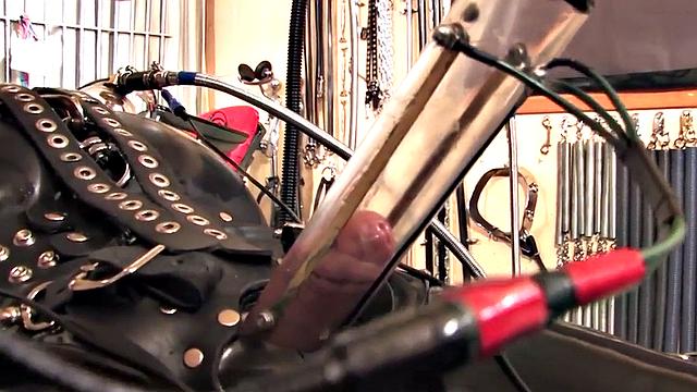 Femdom latex domina torments sub with cock pump