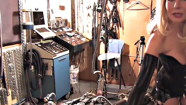 Femdom latex domina torments sub with cock pump