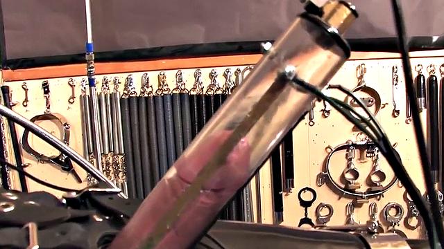 Femdom latex domina torments sub with cock pump