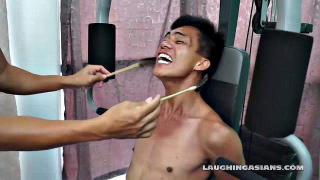 If you love male feet tickling, then this one is sure to excite you beyond your wildest dreams! Cute and sexy Asian boy Argie drops by for his first gym workout with Trainer.