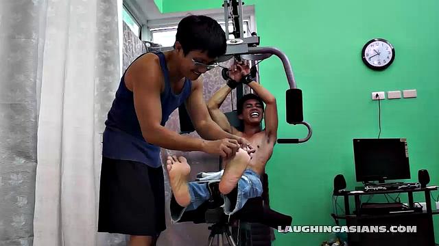 If you love male feet tickling, then this one is sure to excite you beyond your wildest dreams! Cute and sexy Asian boy Argie drops by for his first gym workout with Trainer.