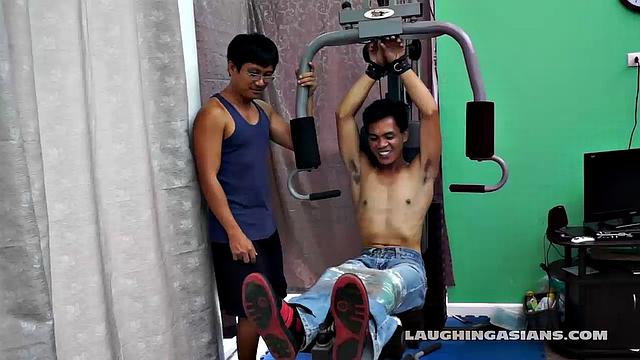 If you love male feet tickling, then this one is sure to excite you beyond your wildest dreams! Cute and sexy Asian boy Argie drops by for his first gym workout with Trainer.