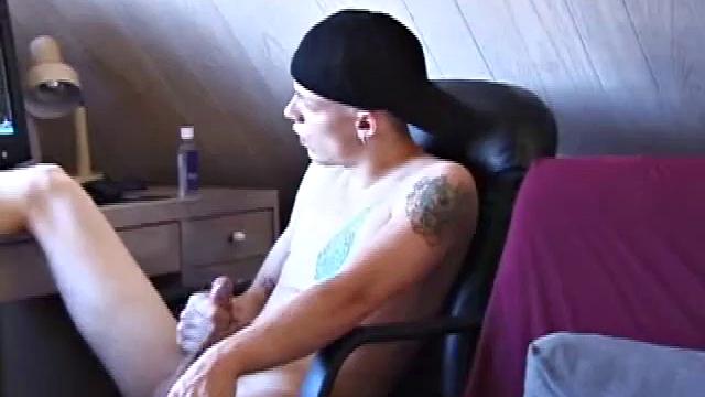 After skateboarding, Shane is ready to relax and stroke one out, so he finds some inspiration on the computer and begins massaging his cock. He pulls his shorts off and lubes up, then works his slippery cock.