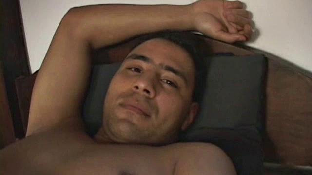 Matheus returns to the military dorm after morning run to find dorm mate still snoozing.