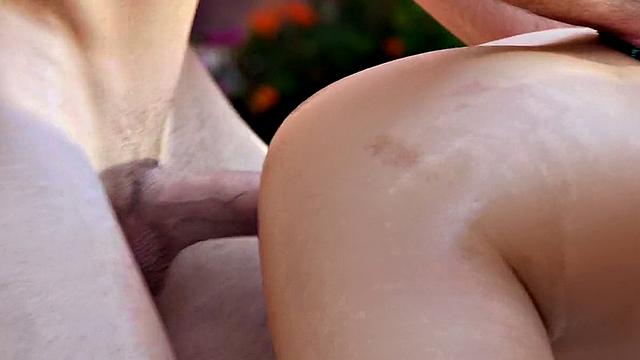 Latina with tattoos gets her trimmed pussy drilled from behind while giving a handjob in high heels