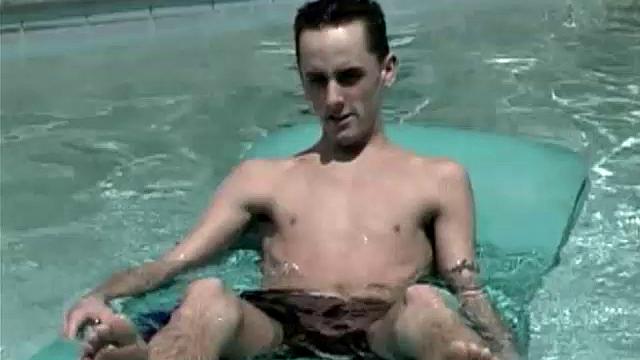 Cooling off in the pool, 19-year-old Garrett Brennan is horny and needs to relieve himself. After getting comfortable in a poolside lounge chair, he proceeds to stroke his throbbing uncut 7-inch cock until he releases his load into the air.