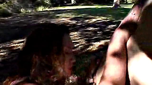 Two teenage lesbians licking each other's outdoors