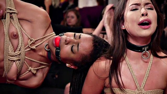 Dominated black submissive drilled in group and clamped