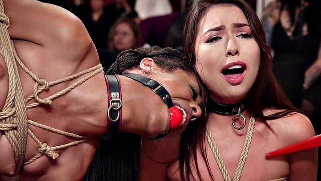 Dominated black submissive drilled in group and clamped