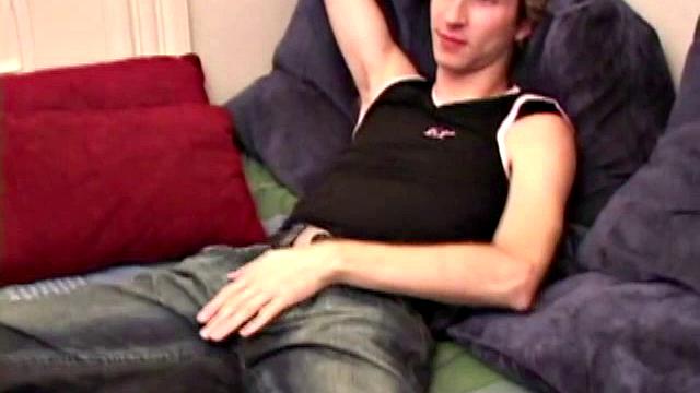 Amateur Jenson McGill rubs his crotch while watching porn, strips off clothes to stroke stiff cock & cum on face