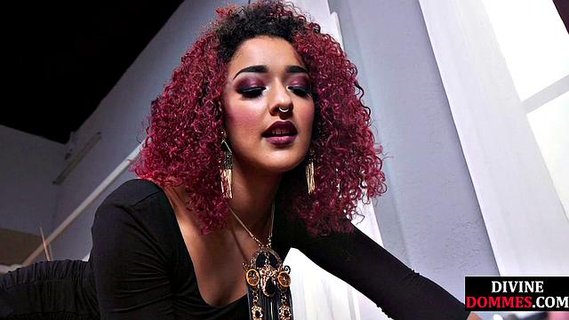 CBT submissive facing redhead dominatrix