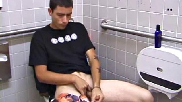 A public restroom is Dan's secret spot to beat off. He flips through some porn magazines as he jerks on his lubed up cock. When he's ready to pop, Dan cums onto his skateboard.
