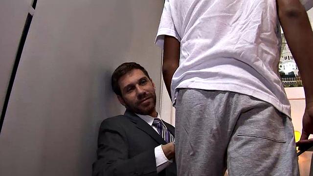 One of the Latino employees has screwed up on the job and daddy Andres needs to give the boy some schooling. With young Allen at his desk, Andres likes what he sees.