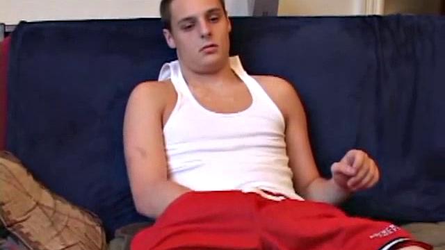 Gunner Raines rubs his cock thru his shorts, and then releases a growing boner. A sex toy plugs up Gunner's butthole. The added anal stimulation has the young man pumping a warm load onto his stomach.