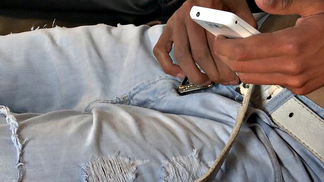 Our featured solo boy of the week is Adrian, who sits on a sofa and starts looking at porn on his phone. With the shirt off and pants unzipped, he takes hold of his growing uncut cock.