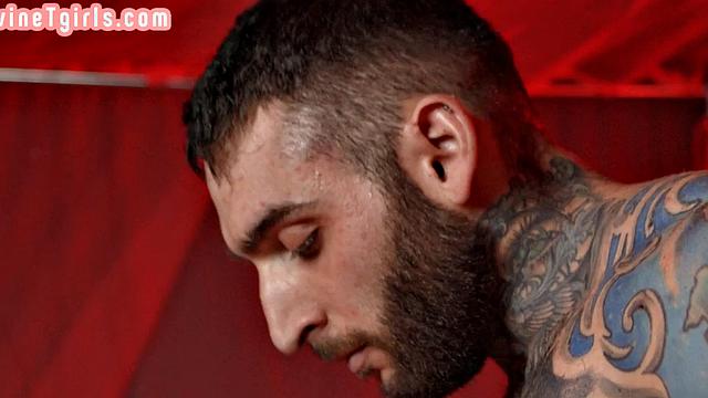 Deepthroating Tranny gets barebacked by lover in red room