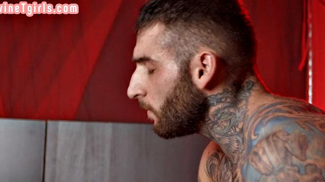 Deepthroating Tranny gets barebacked by lover in red room