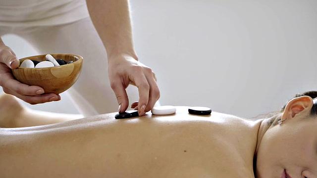 Massaging seducing her clients muff with erotic licking