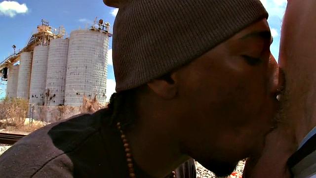 Amateur jock with tattoos takes a deep interracial pounding in public by a black top