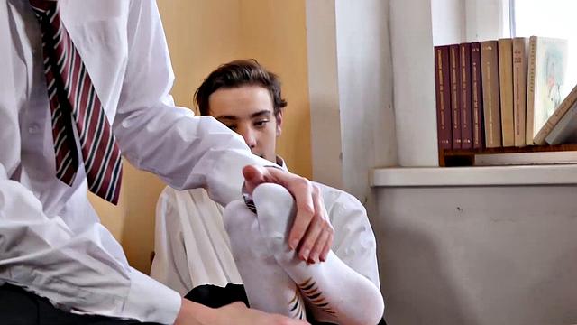 With his white socked feet propped up on the headmaster's desk, Johannes is relaxing after a long school day. Chad walks in and grows a boner at the sight of his buddy's feet.
