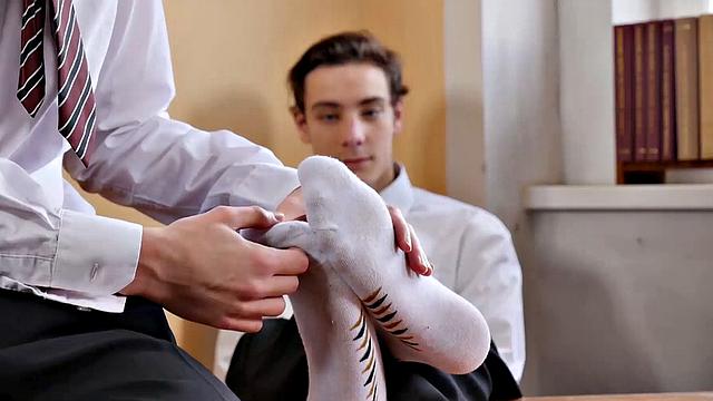 With his white socked feet propped up on the headmaster's desk, Johannes is relaxing after a long school day. Chad walks in and grows a boner at the sight of his buddy's feet.