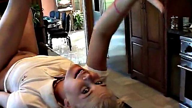 Cute blonde enjoys solo masturbation