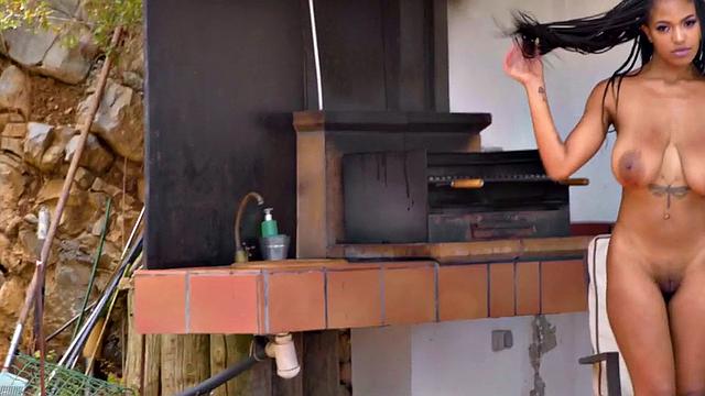 Big-titted ebony babe doggystyled outdoors by her lover