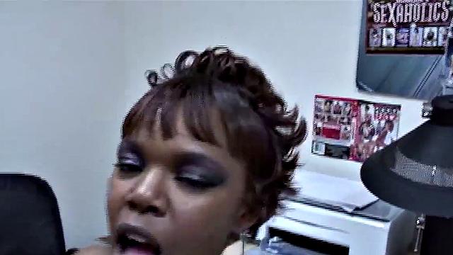 Older black amateur woman in boots with white