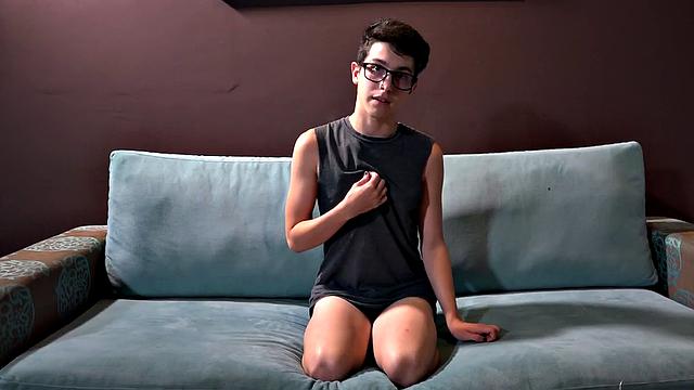 Phillip is a cute and nerdy looking Latin twink. After he strips naked, Giorgio joins him on the sofa and starts stroking the boy's big cock. Then Giorgio pushes his underwear down, so Phillip can suck his dick.