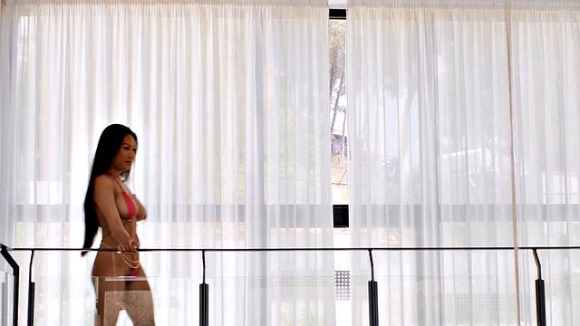 Squirting big-titted Asian babe fucked in her pierced pussy