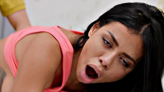 Brunette with tattoos rides cock in doggystyle with ass up and pussy down while getting a handjob and blowjob from a Colombian guy