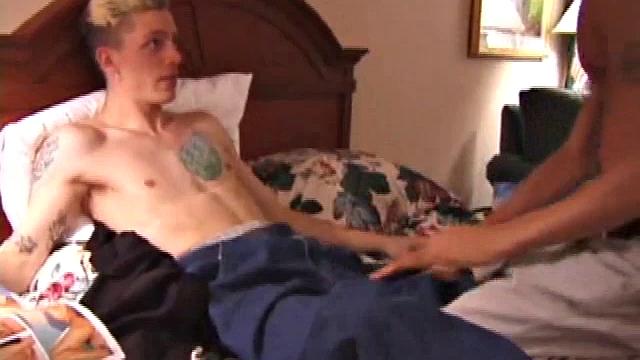 Derrick Hanson throws a porn magazine to Shane and keeps a magazine for himself. Lying on the hotel bed together they flip through the pictures of the magazines showing each other what pictures are turning them on.