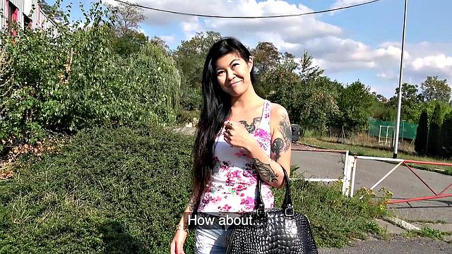 A tattooed Asian babe moan with pleasure as she gets girthy and takes it from behind