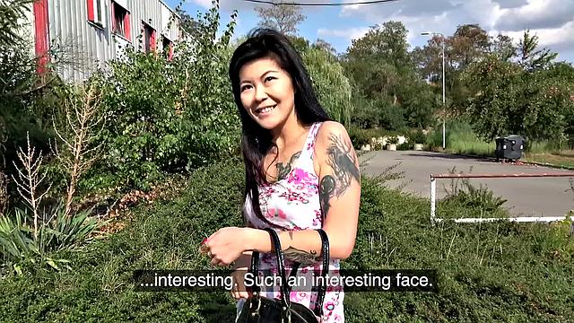 A tattooed Asian babe moan with pleasure as she gets girthy and takes it from behind