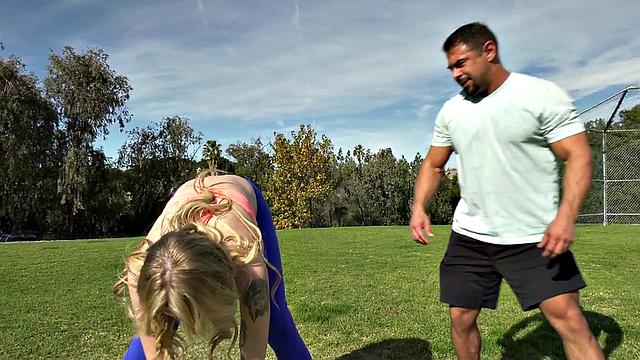 Tattooed blonde tgirl gets bred from behind in the gym