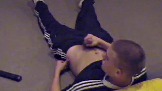 Lance pops a porn video in and pulls out his boner, then starts a nice long stroke shoe, getting himself close to climax several times. Once past the point of no return, he pumps out a nice cum load onto his belly.