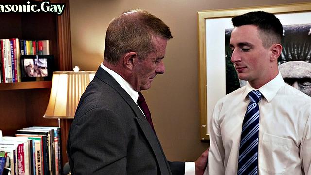 Suited mason fucks ass of bottom stud in office