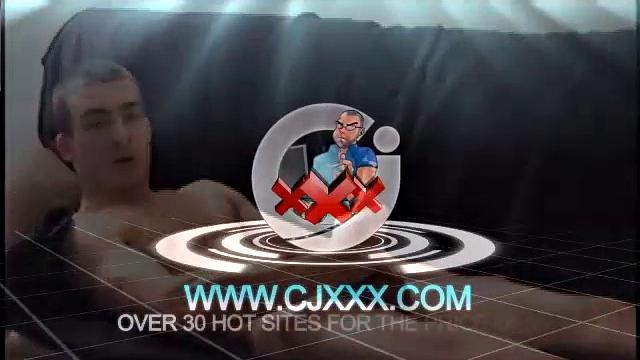 Darrell kicks back on the couch and releases a big cock through his fly. At the same time, he pulls off his dress shirt and tie.