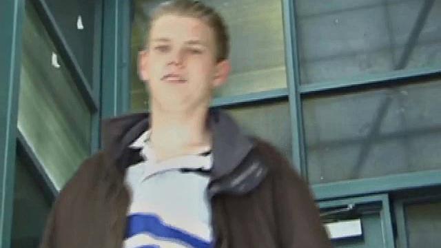 We catch up with Christian on an outdoor stairway. He leads us to a men's room with glory holes. Tere, Christian jacks off to photos in a straight porn magazine.