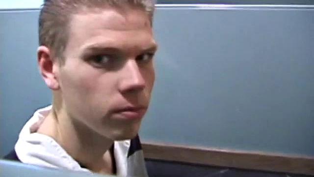 We catch up with Christian on an outdoor stairway. He leads us to a men's room with glory holes. Tere, Christian jacks off to photos in a straight porn magazine.