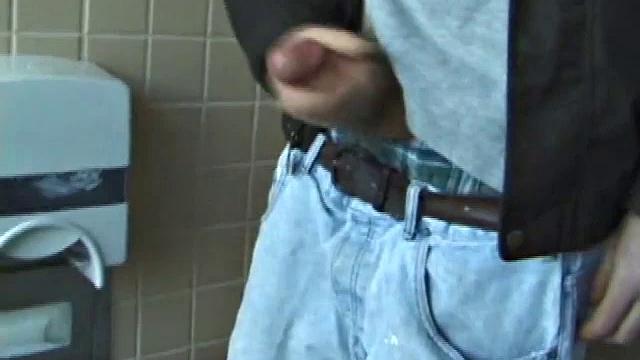 We catch up with Christian on an outdoor stairway. He leads us to a men's room with glory holes. Tere, Christian jacks off to photos in a straight porn magazine.