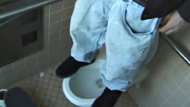 We catch up with Christian on an outdoor stairway. He leads us to a men's room with glory holes. Tere, Christian jacks off to photos in a straight porn magazine.